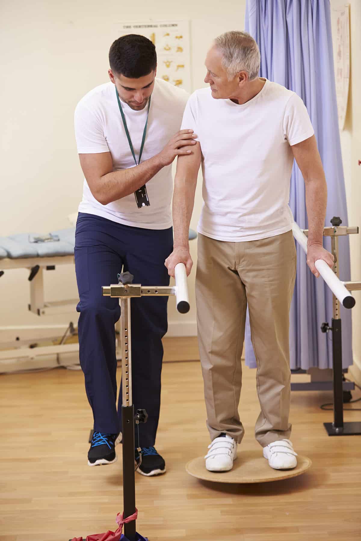 Physical therapist working with a man on a balance device, Learn how the Compact works for travel PTs and OTs